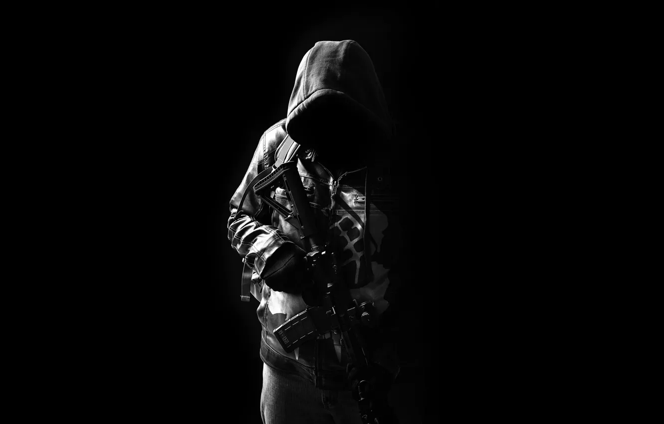 A hooded figure with a concealed face holding a rifle